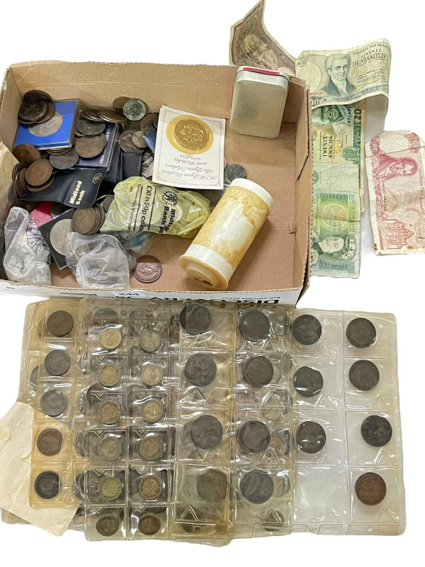 Box of coins, tokens and bank notes.