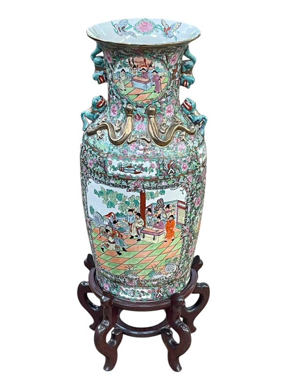 Large pair of floor standing Cantonese famille rose vases with decorated panels on floral ground each on six footed wooden stands, 86cm including stand.