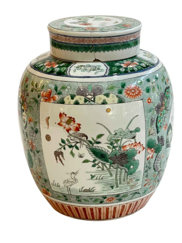Chinese famille verté jar and cover decorated with panels on floral ground, Qing Dynasty, 24cm.