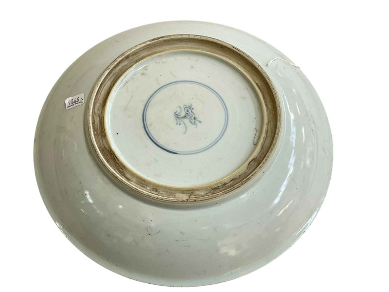 Chinese pottery circular dish decorated with geisha at a coffee table admiring a shanshui scroll, the base with a leaf motif within a double circle, 28.5cm.