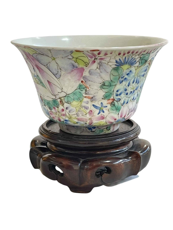 Chinese famille rose floral decorated bowl on wood stand with Qianlong mark to base, height with stand 10cm.