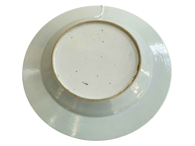 Chinese pottery plate with central portrait and cherub and floral border, 22cm.