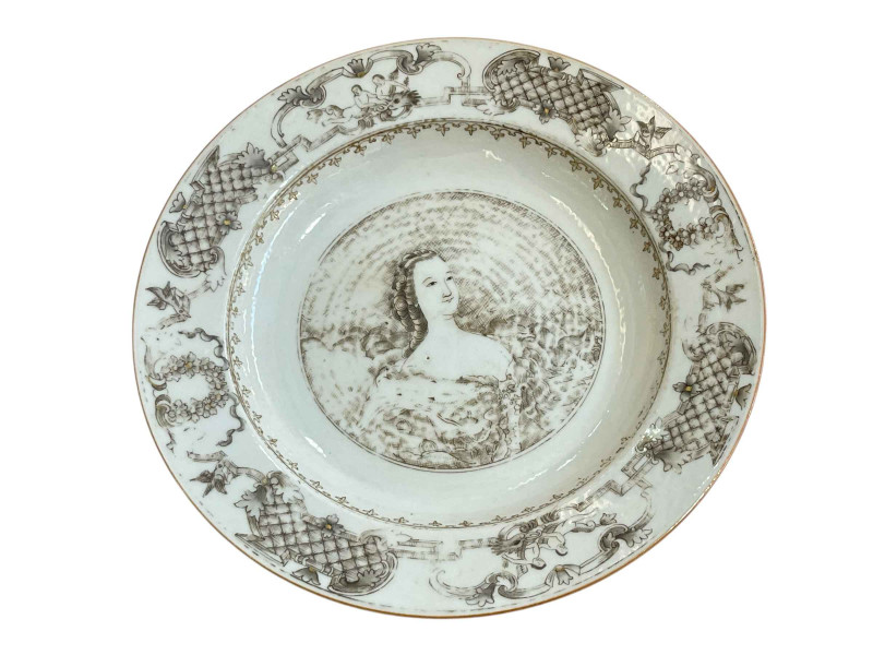 Chinese pottery plate with central portrait and cherub and floral border, 22cm.