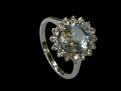 Oval aquamarine and diamond ring set in 18 carat white gold, the central 2 carat aquamarine surrounded by sixteen small diamonds totalling 0.50 carats, size O. thumbnail