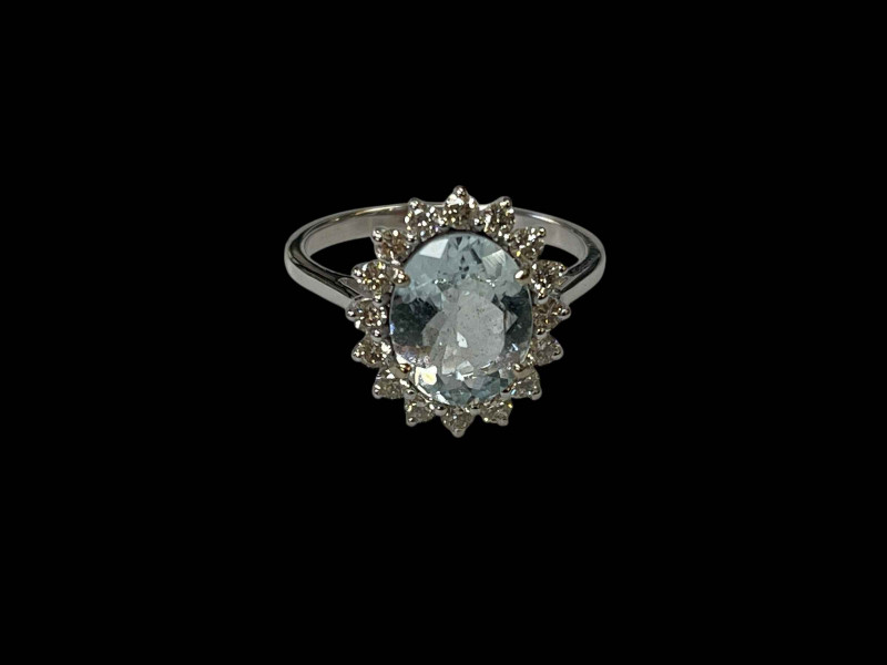 Oval aquamarine and diamond ring set in 18 carat white gold, the central 2 carat aquamarine surrounded by sixteen small diamonds totalling 0.50 carats, size O.