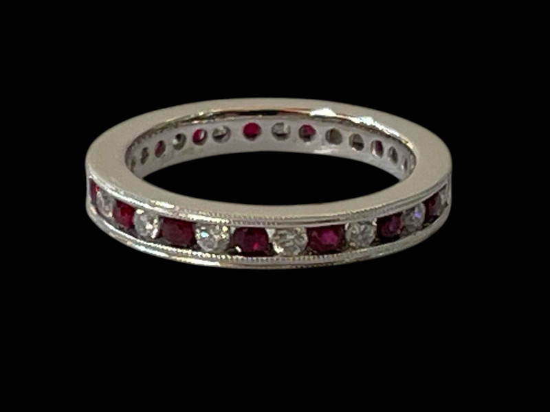 Diamond and ruby 9 carat white gold eternity ring, size N.