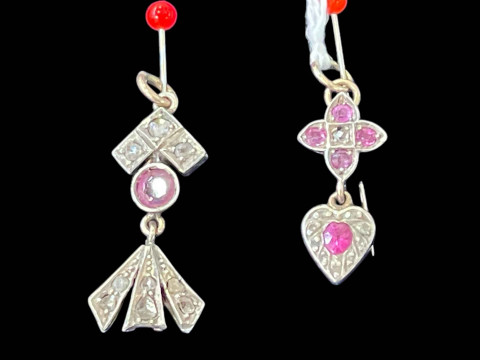 Two small diamond and ruby set pendants.