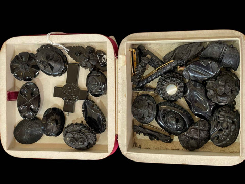 Collection of Whitby Jet brooches and pendants.