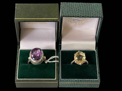 Two silver rings with amethyst and citrine.