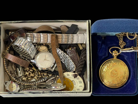 Box of watches and straps in Rolex box.