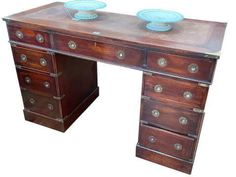 Campaign style nine drawer pedestal desk, 76cm by 123cm by 54.5cm.