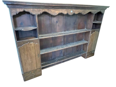 Antique oak dresser top having three central shelves flanked by a shaped...