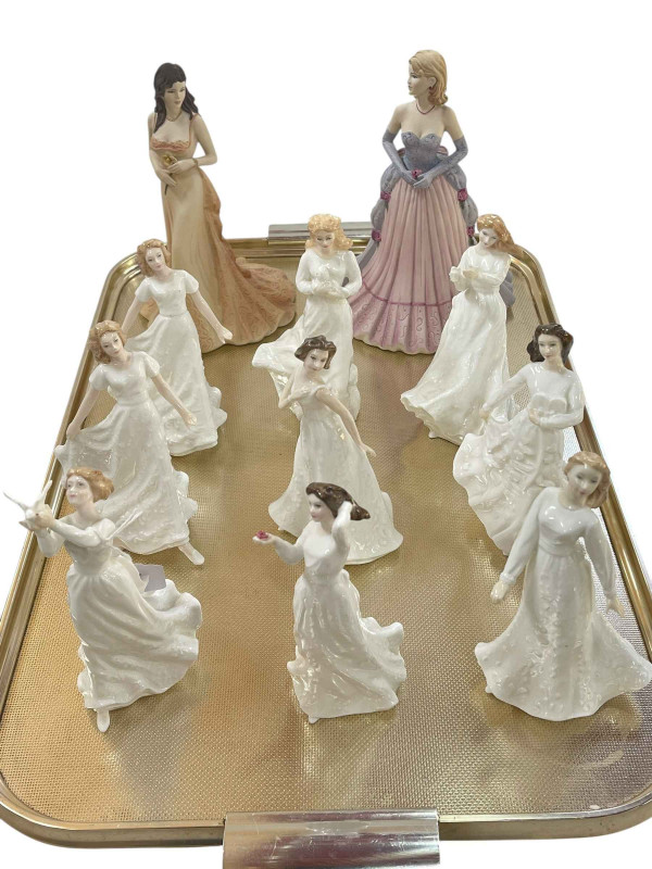 Two large Coalport ladies and nine Royal Doulton ladies.