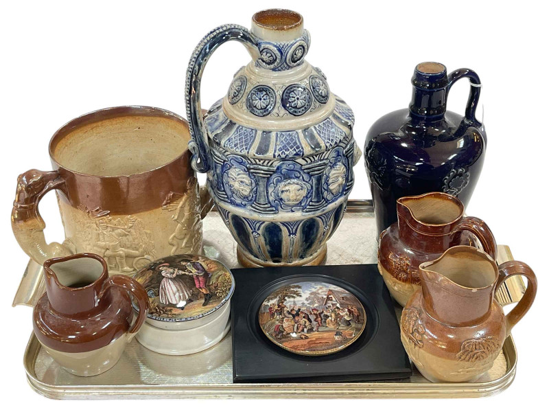 T Smith & Co, Old Kent Road, London, blue and white stoneware flagon, Doulton stoneware bottle, three stoneware jugs and two Prattware pot lids.