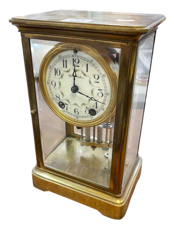 Brass and four glass mantel clock with enamel dial and mercurial pendulum.