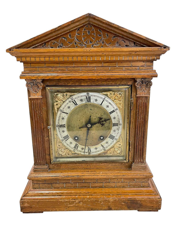Oak cased bracket clock with brass and silvered dial.