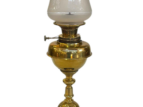 Art Nouveau brass oil lamp with frosted and etched glass shade.