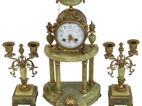 Ornate three piece gilt metal and onyx clock garniture with enamel dial.