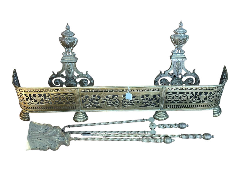 Victorian pierced brass fender, pair of large brass fire dogs and set of three fire irons.