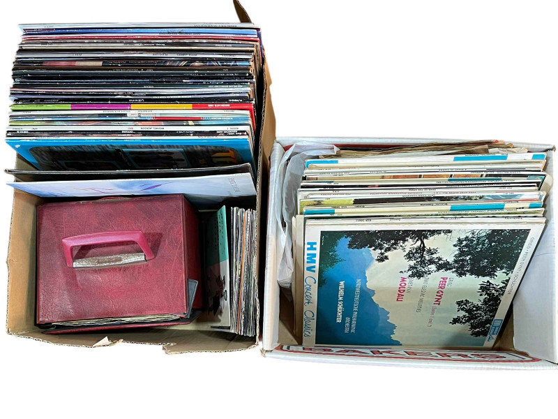 Four boxes of vinyl LP records and singles.