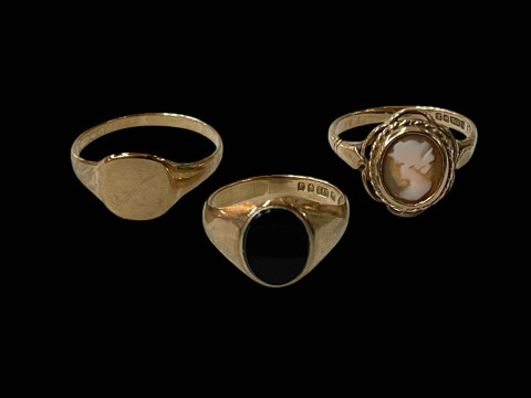 Three 9 carat gold rings.