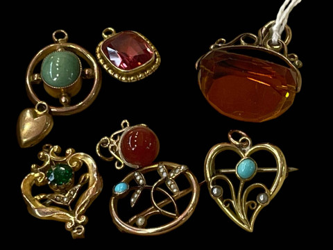Collection of eight mostly gold brooches, pendants and fob, with turquoise...