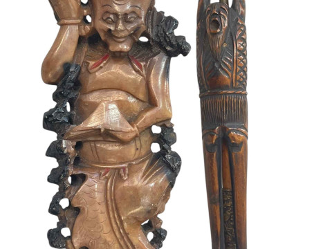 Carved figure holder with pipe and soapstone carving (2).