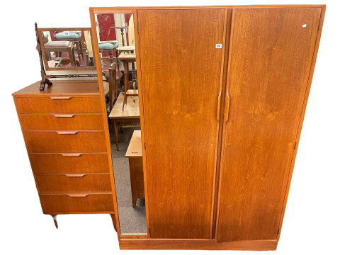 Austin Suite teak two door wardrobe and six drawer chest together with...