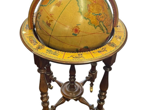 Painted globe on astrological stand.