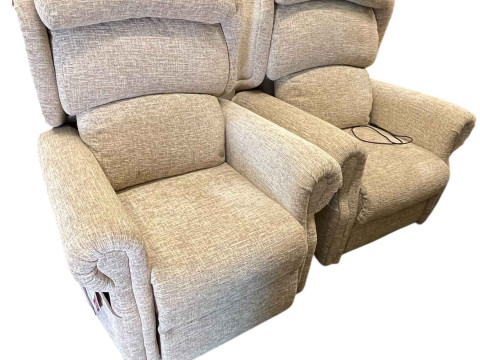 Pair Primacare electric rise and fall reclining chairs in light fabric.