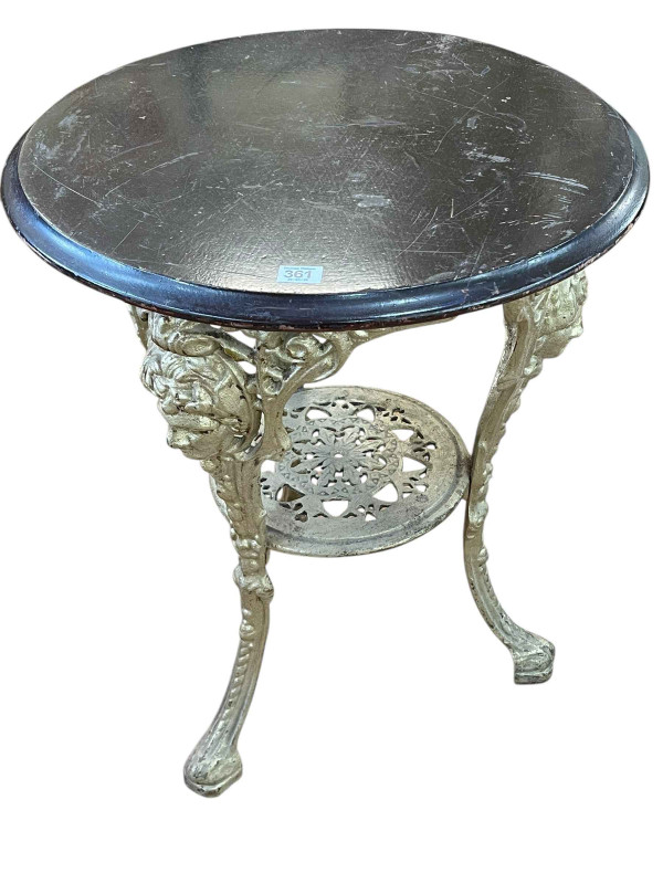 Circular cast base pub table, 70cm by 56cm diameter.