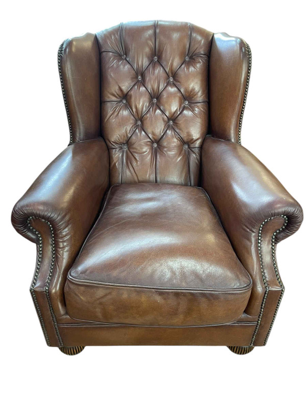 Tetrad Oskar brown leather button backed and brass studded Chesterfield armchair, 95cm by 85cm by 95cm.