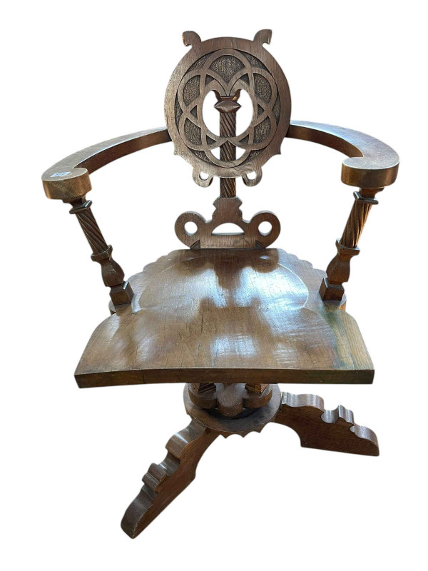 Early 20th Century carved swivel desk chair.