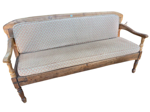 Antique panelled back settle on turned legs with seat and back cushion,...
