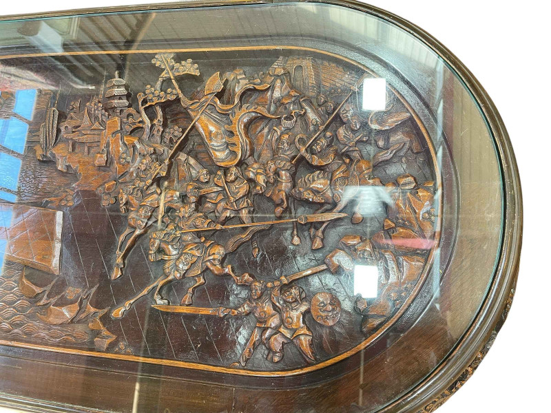 Large Oriental carved oval low centre table and six stools, table, 52cm by 157cm by 70cm.