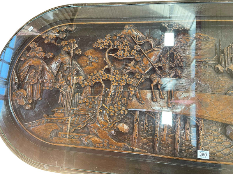 Large Oriental carved oval low centre table and six stools, table, 52cm by 157cm by 70cm.