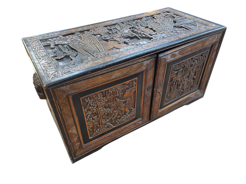 Oriental carved camphorwood low two door cabinet, 51cm by 97cm by 47cm.