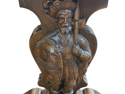 Rectangular oak coffee table raised on carved figural Knight supports joined by stretcher, 57cm by 116cm by 60cm. thumbnail