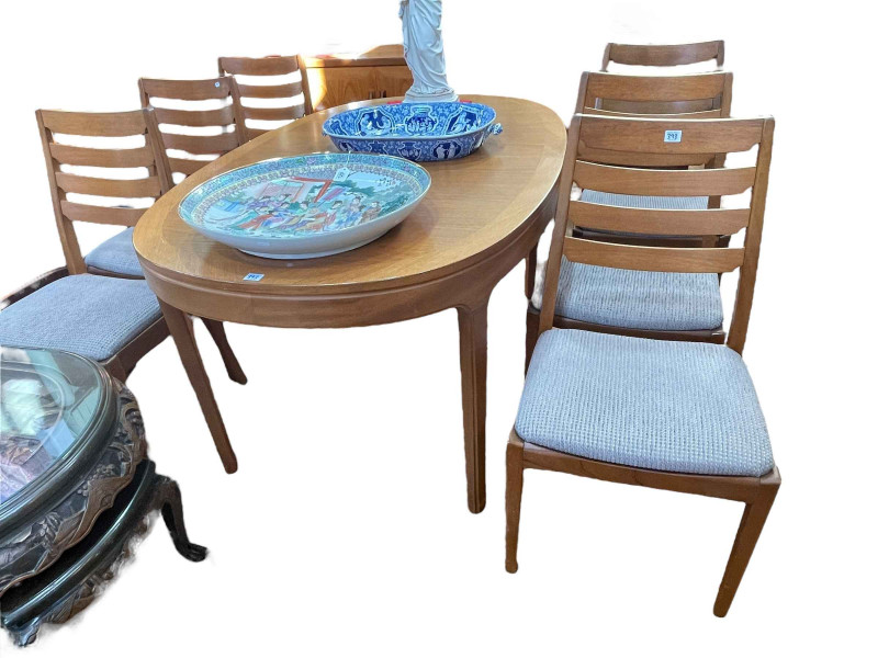 Teak eight piece dining suite comprising long john sideboard, 80cm by 206cm by 45.5cm, oval extending dining table with integral leaf, 75.5cm by 99cm by 153cm (excluding leaf), and set of six ladder back dining chairs.