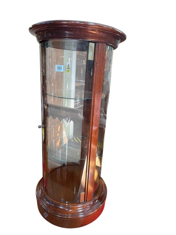 Cylindrical display cabinet with two adjustable shelves, 88cm by 41cm diameter.