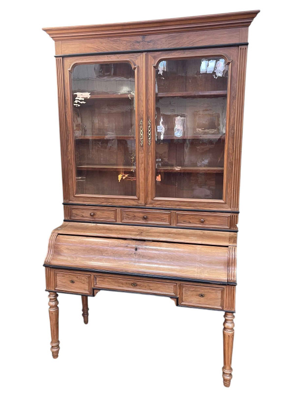 Late 19th Century walnut and ebonised secretaire cabinet bookcase having two glazed panel doors above three drawers and a pull out secretaire and three drawers below on turned fluted legs, 232cm by 140cm by 60cm.
