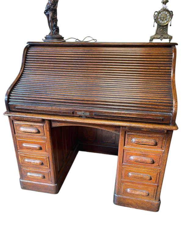 Early 20th Century oak seven drawer roll top pedestal desk, 125cm by 127cm by 80cm.