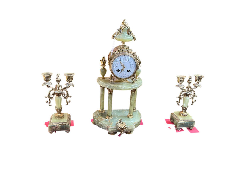 Ornate three piece gilt metal and onyx clock garniture with enamel dial.