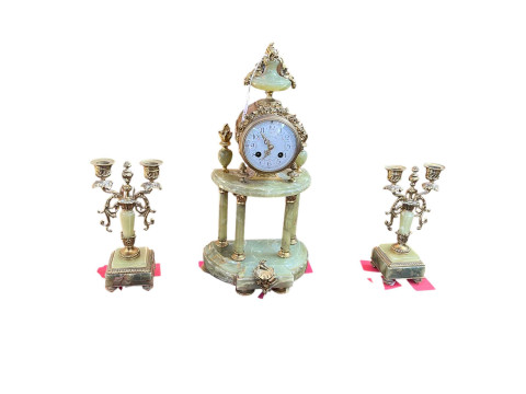 Ornate three piece gilt metal and onyx clock garniture with enamel dial.