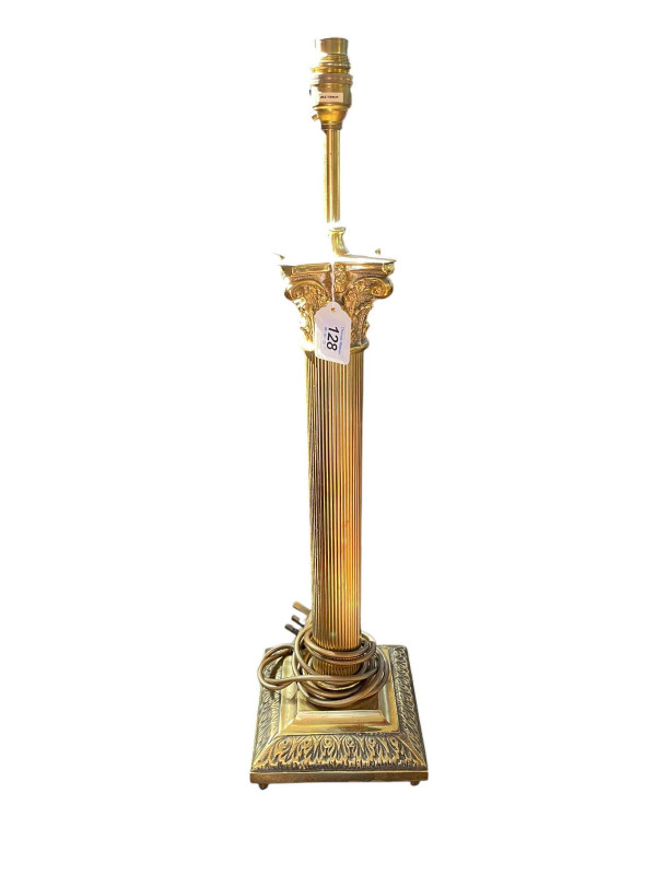 Gilt corinthian column table lamp, 66cm high.