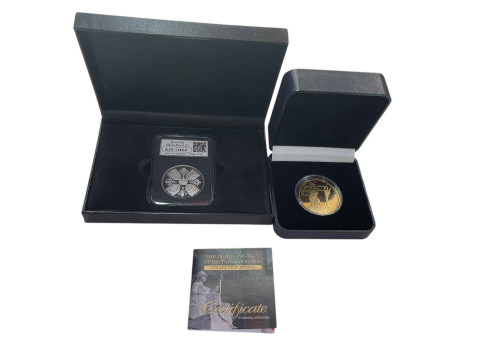 Britannia silver coin and a 2014 silver proof £5 coin in case.