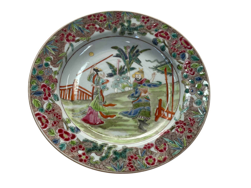 Chinese famille rose plate decorated with figures in a garden with floral border, 22.5cm diameter.