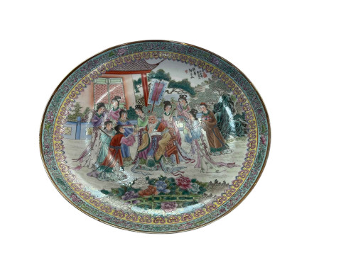 Large Chinese pottery charger decorated with elder and female figures...