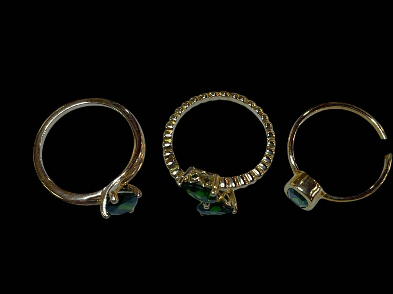 Three 9 carat gold and green diopside rings.
