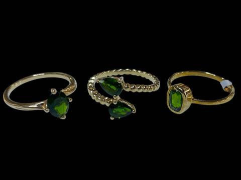 Three 9 carat gold and green diopside rings.